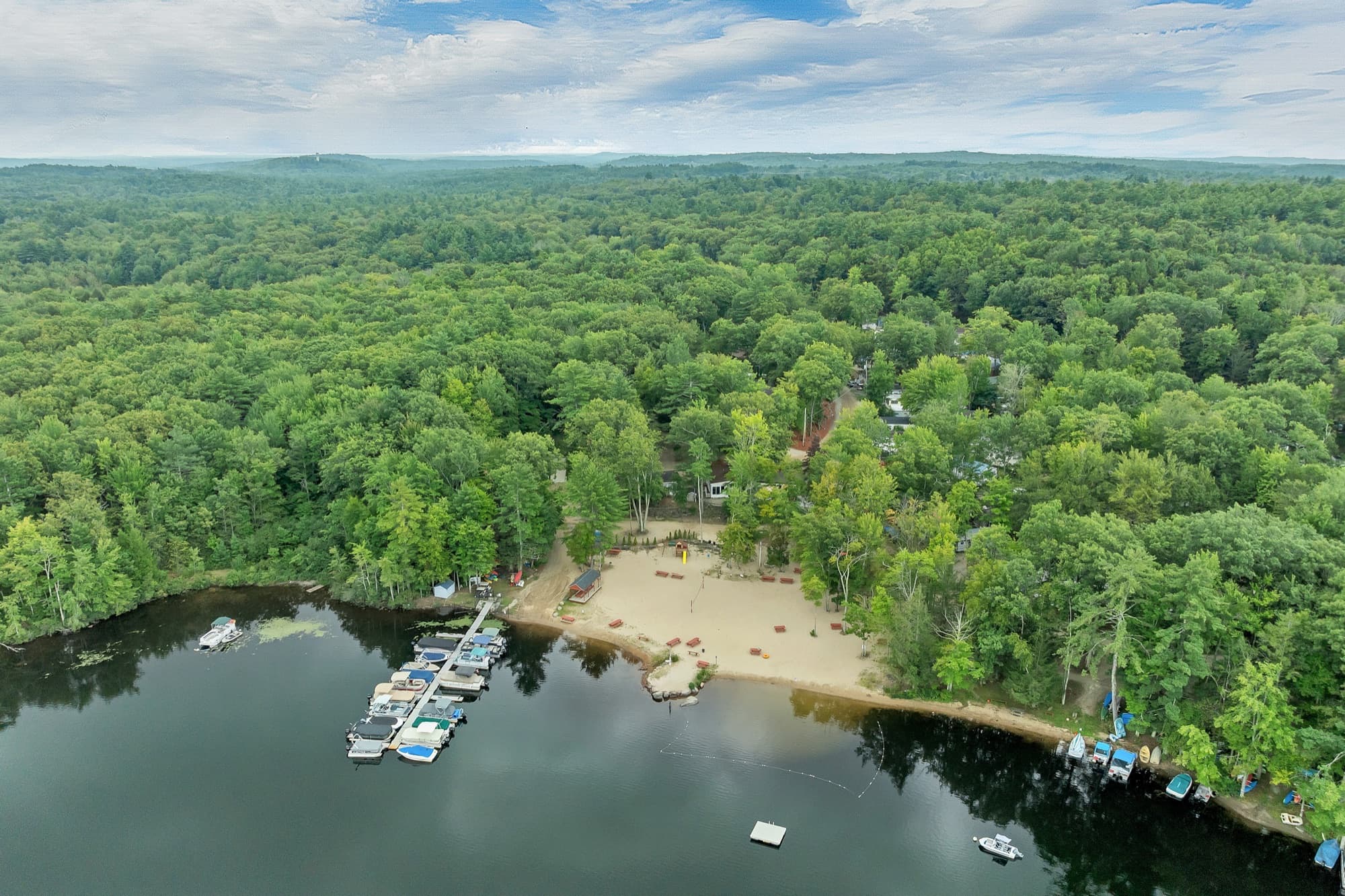 Aerial view over the beach and docks toward the campground